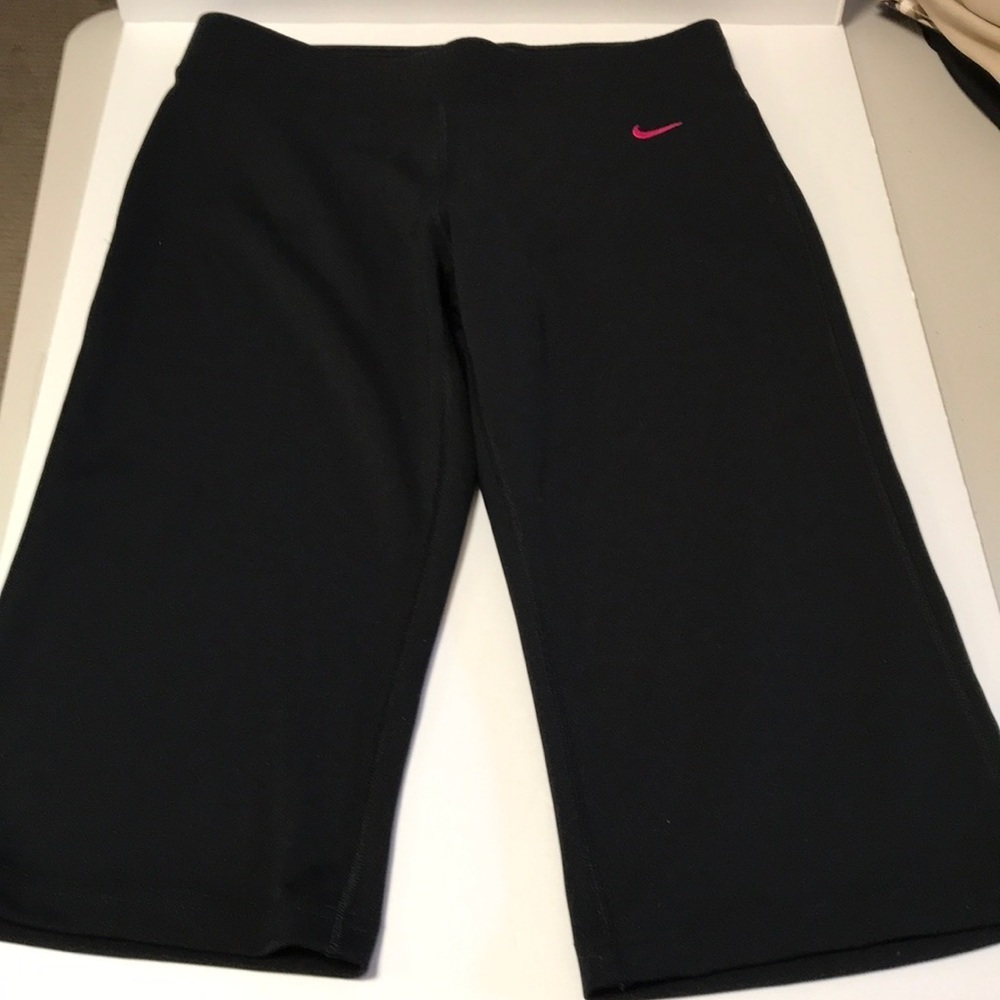 Nike black exercise capris with hot pink logo